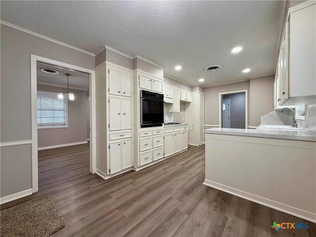 2407 East Airline Road Victoria, TX 77901 - Photo 7 of 38 a living room with furniture wooden floor and a flat screen tv