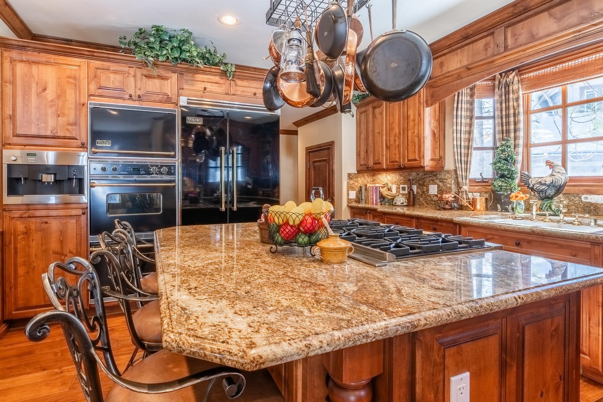105 Northstar Circle Mammoth Lakes, CA 93546 - Photo 12 of 49 a kitchen with stainless steel appliances granite countertop a sink a stove and a wooden cabinets