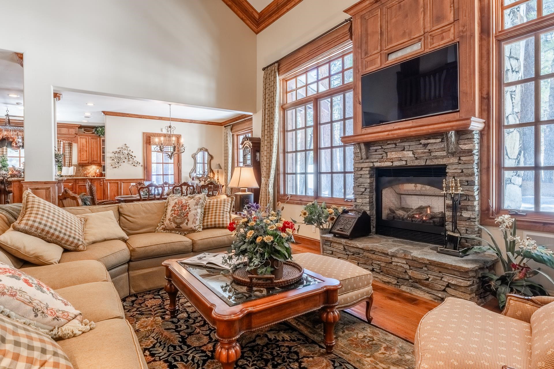 105 Northstar Circle Mammoth Lakes, CA 93546 - Photo 2 of 49 a living room with furniture a fireplace and a large window
