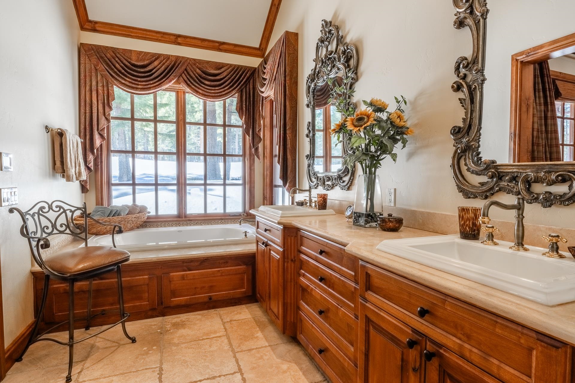 105 Northstar Circle Mammoth Lakes, CA 93546 - Photo 23 of 49 a spacious bathroom with a granite countertop sink and a large mirror