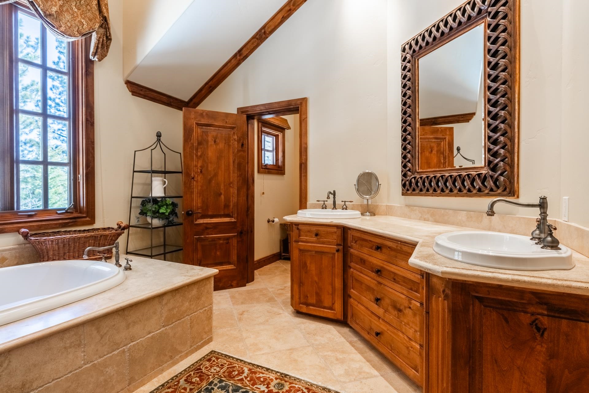 105 Northstar Circle Mammoth Lakes, CA 93546 - Photo 28 of 49 a spacious bathroom with a double vanity sink double mirror and bathtub