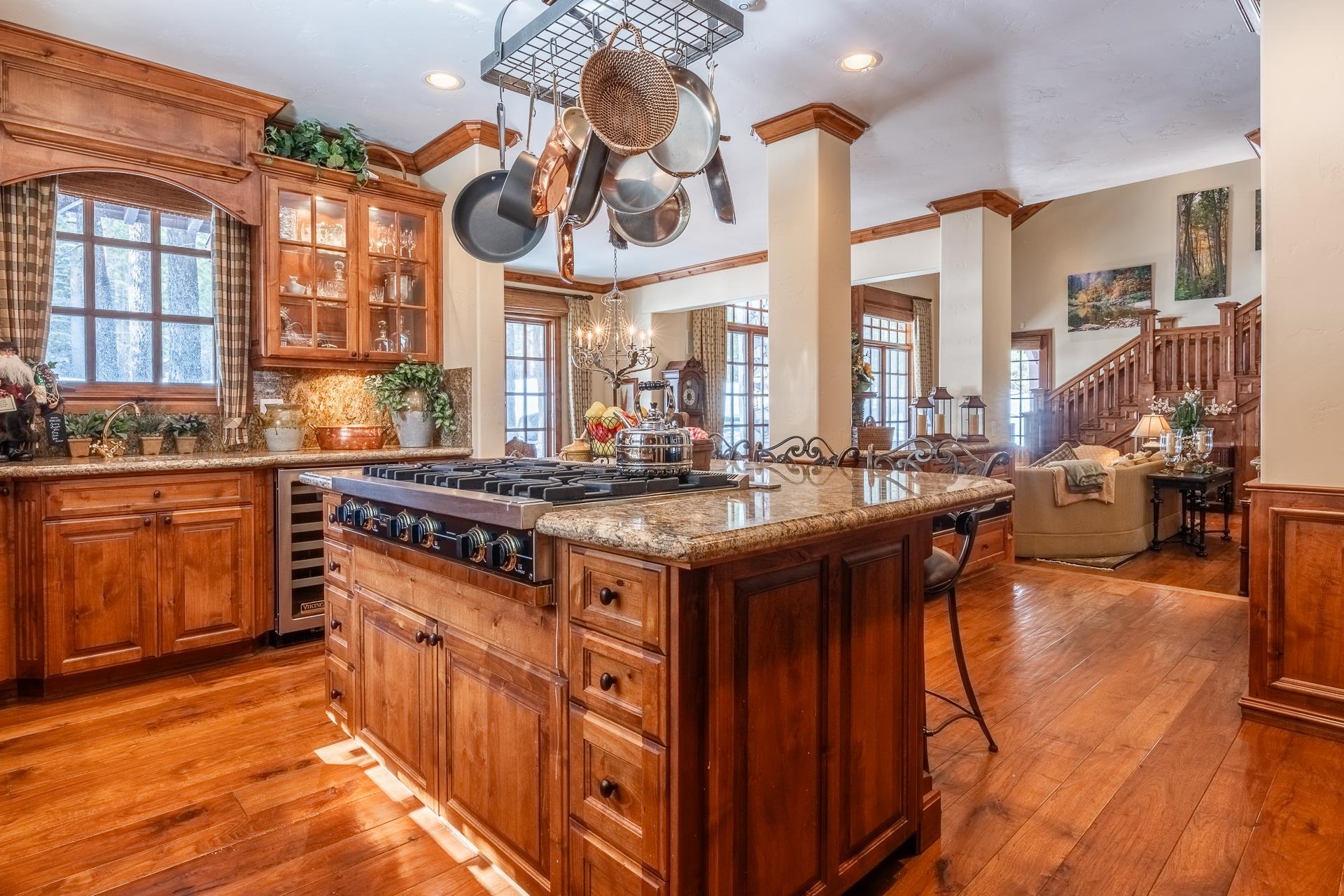 105 Northstar Circle Mammoth Lakes, CA 93546 - Photo 9 of 49 a kitchen with stainless steel appliances granite countertop a stove and a view of living room