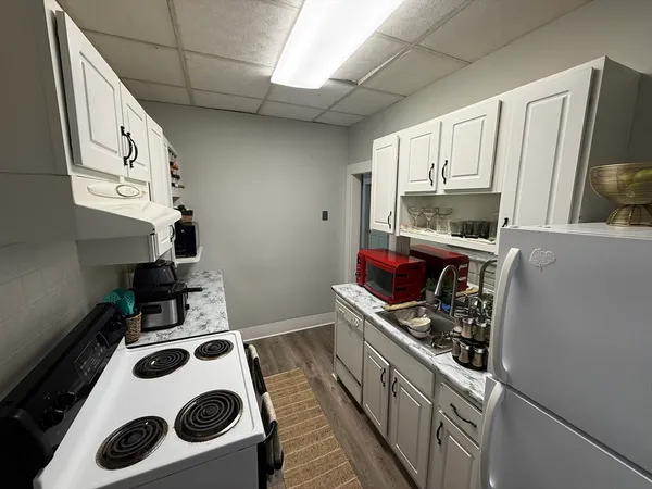 a bedroom with a bed and flat screen tv