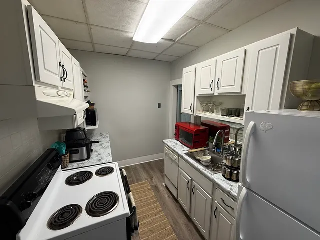 a bedroom with a bed and flat screen tv