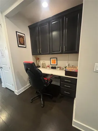 a room with a chair and a microwave