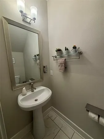 a bathroom with a sink and mirror