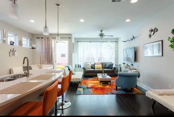 a room with furniture pool table and a window