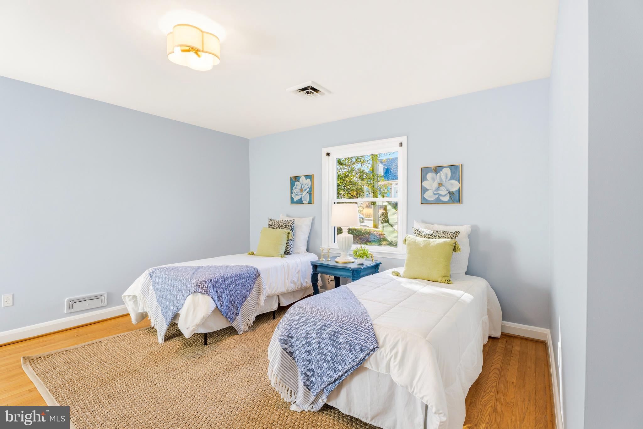 500 Hillen Road Towson, MD 21286 - Photo 13 of 42 a bedroom with two beds and painting on the wall