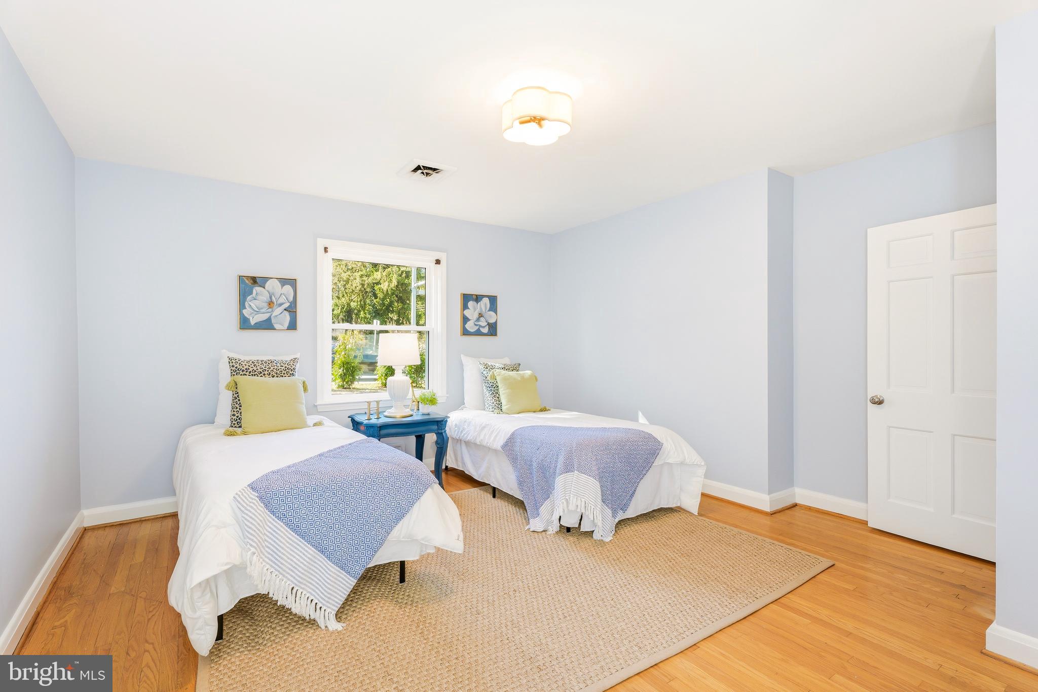 500 Hillen Road Towson, MD 21286 - Photo 14 of 42 a bedroom with furniture and a window