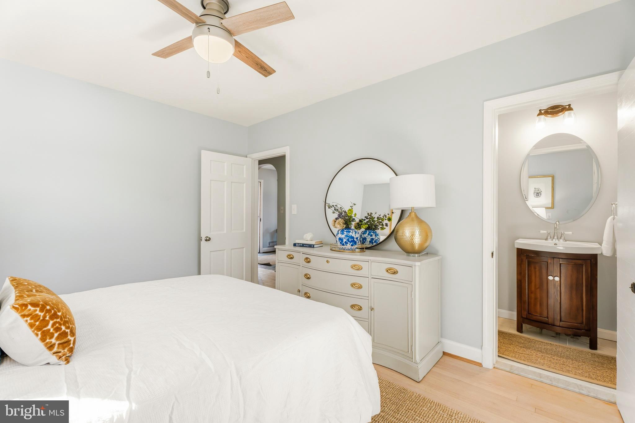 500 Hillen Road Towson, MD 21286 - Photo 20 of 42 a bedroom with a bed and a chandelier