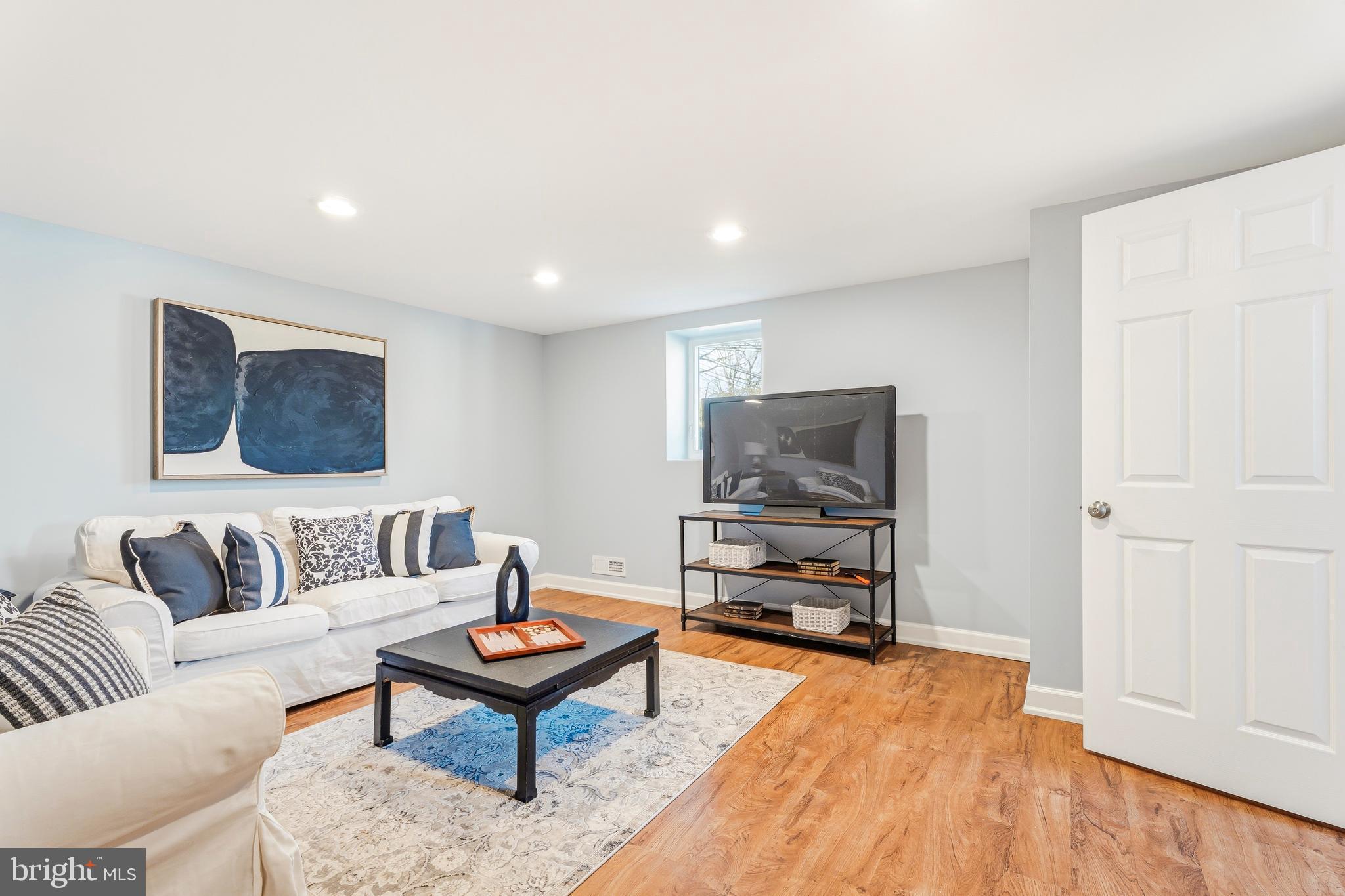500 Hillen Road Towson, MD 21286 - Photo 25 of 42 a living room with furniture and a flat screen tv