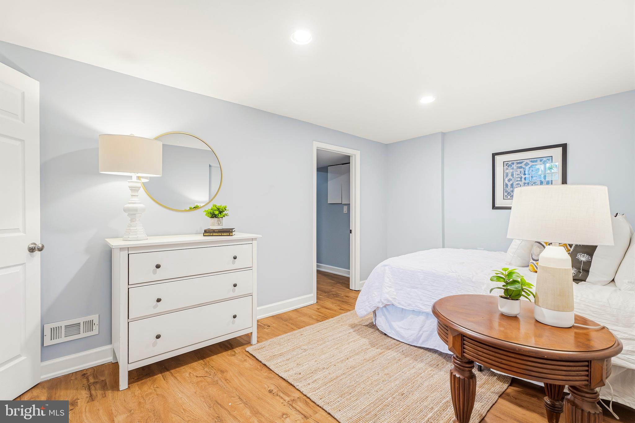 500 Hillen Road Towson, MD 21286 - Photo 27 of 42 a bedroom with a bed and a dresser in it