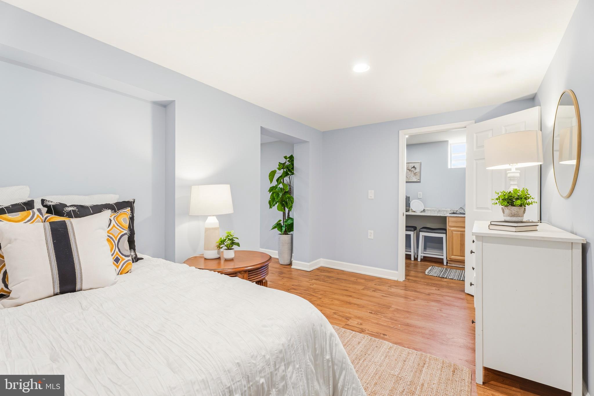 500 Hillen Road Towson, MD 21286 - Photo 29 of 42 a bedroom with a bed and a dresser