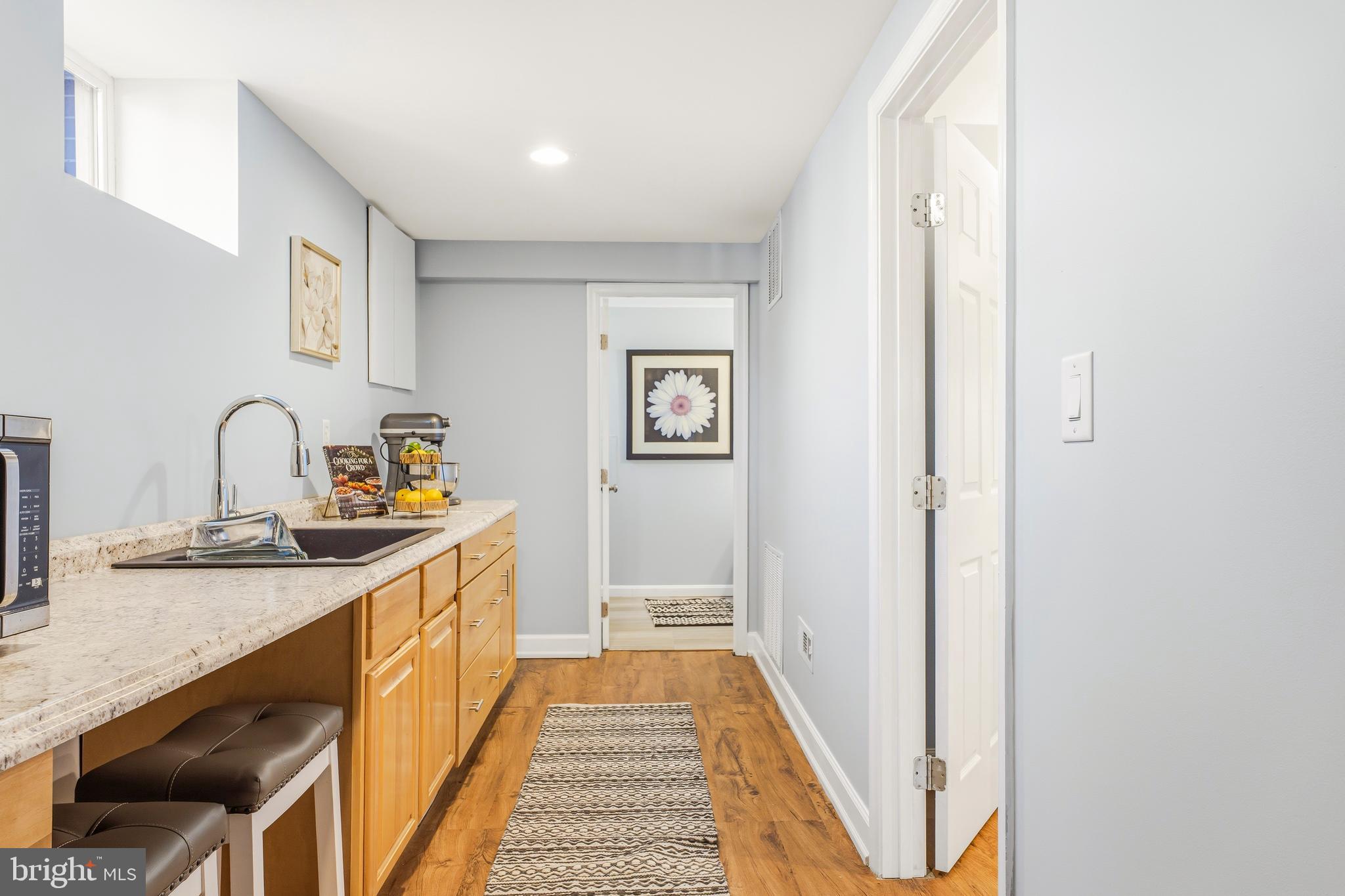 500 Hillen Road Towson, MD 21286 - Photo 30 of 42 a hallway with a sink and a stove top oven