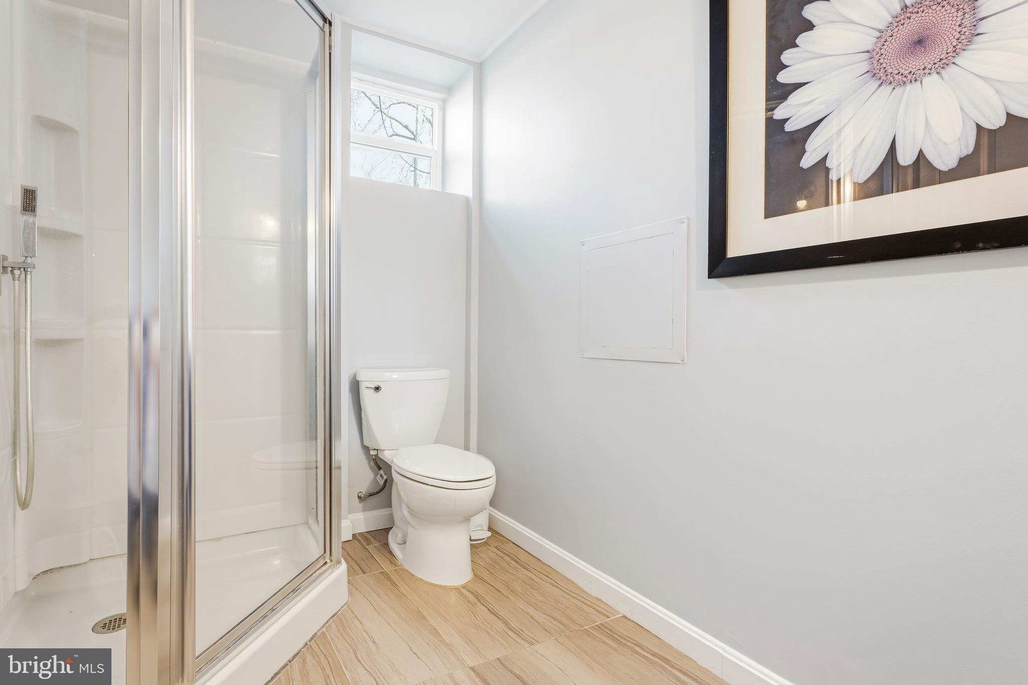 500 Hillen Road Towson, MD 21286 - Photo 33 of 42 a bathroom with a toilet and a shower