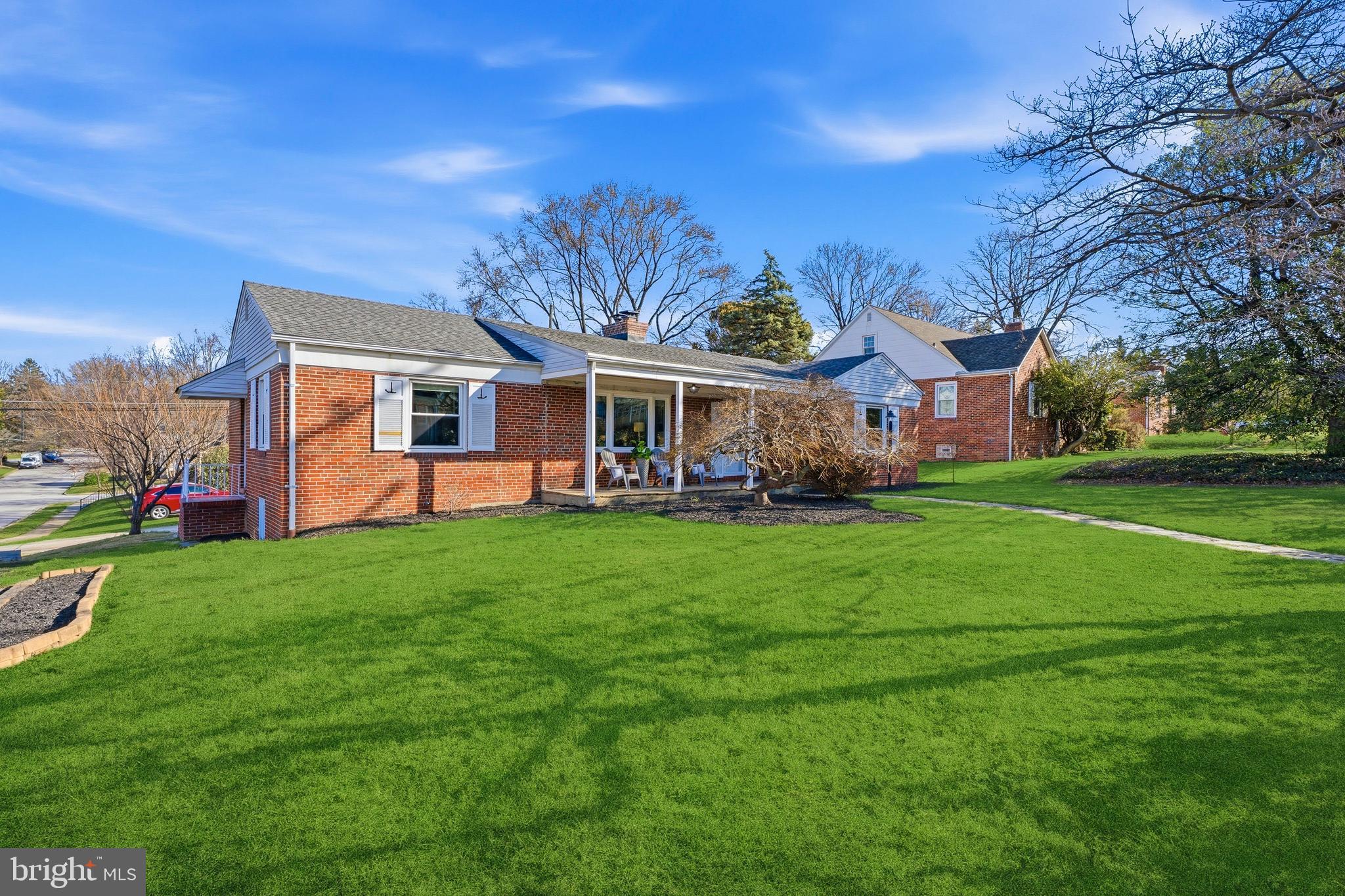 500 Hillen Road Towson, MD 21286 - Photo 41 of 42 a front view of a house with a yard table and chairs