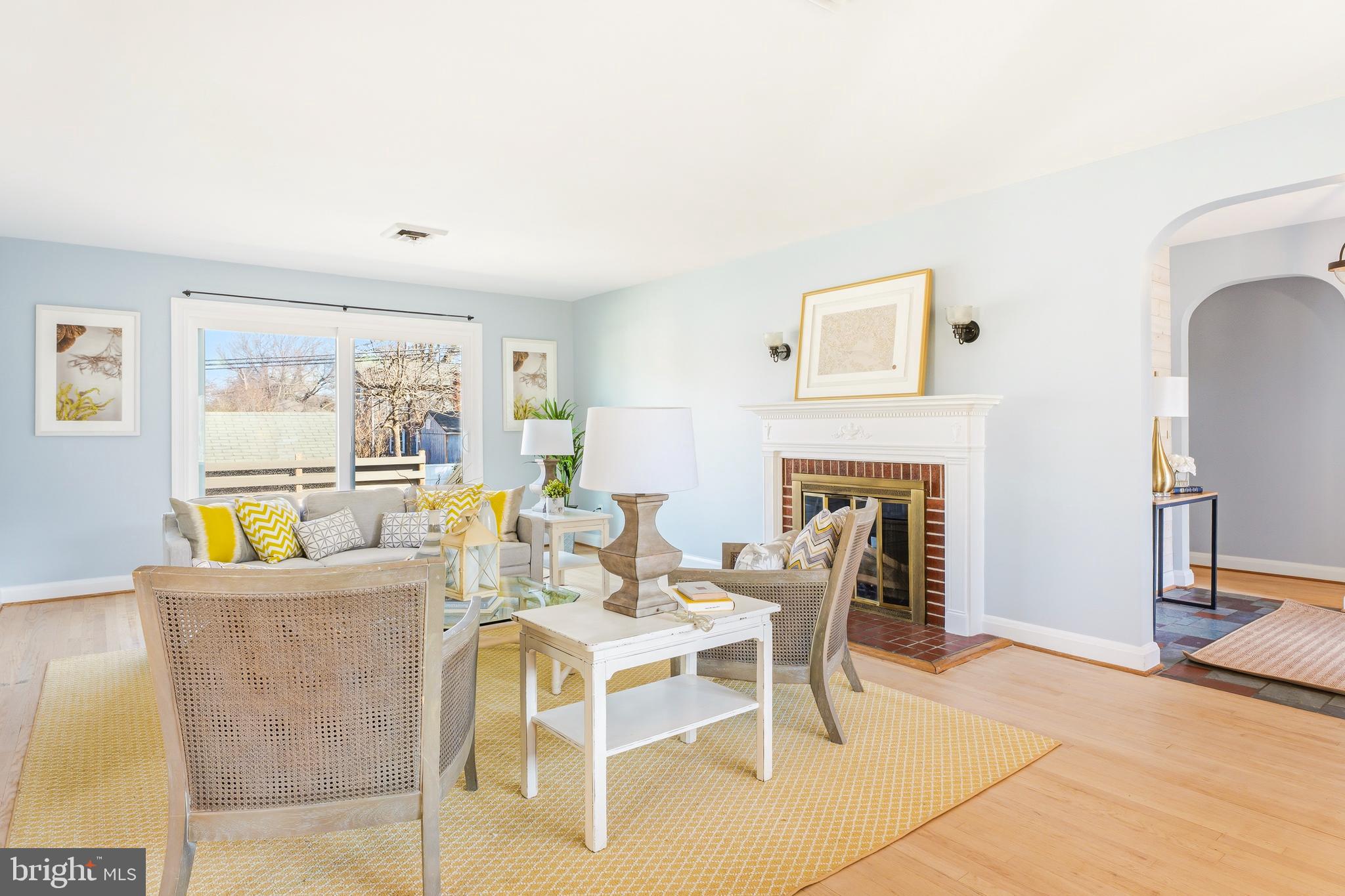 500 Hillen Road Towson, MD 21286 - Photo 6 of 42 a dining room with furniture a fireplace and a floor to ceiling window