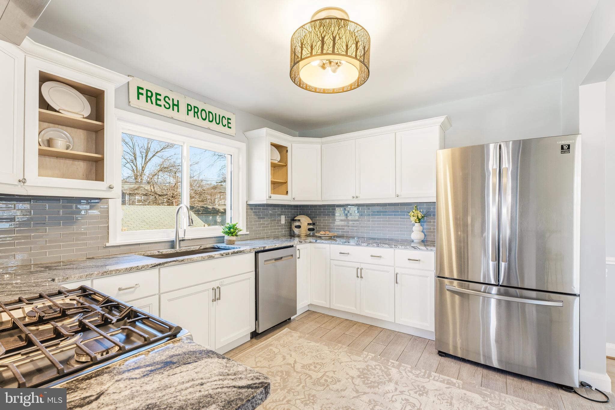 500 Hillen Road Towson, MD 21286 - Photo 10 of 42 a kitchen with stainless steel appliances granite countertop a stove a sink dishwasher and a refrigerator