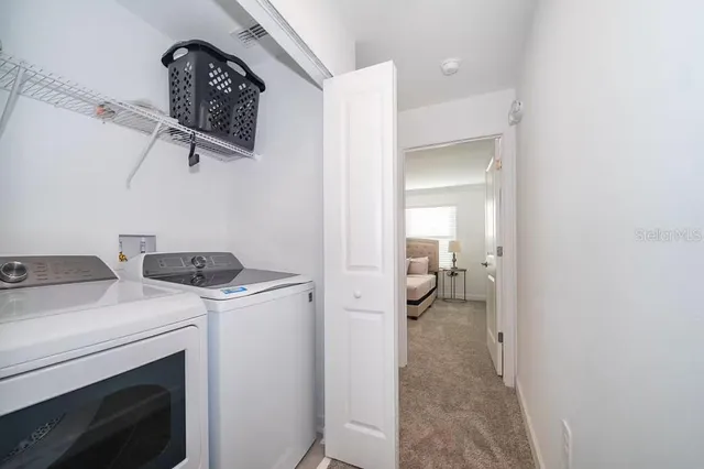a utility room with dryer and washer