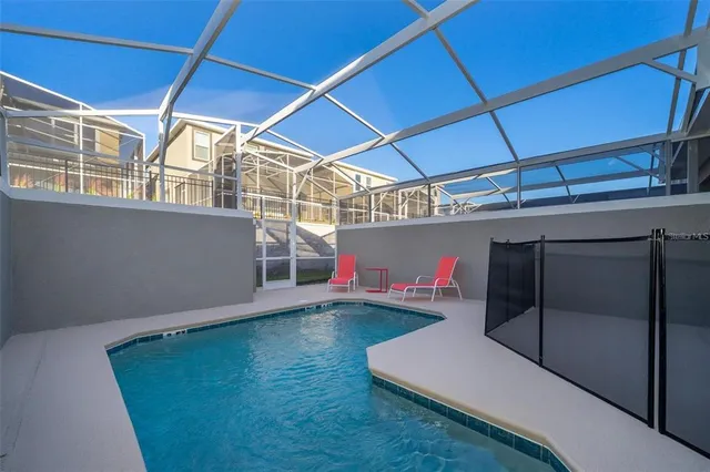 a view of backyard with a table and chairs