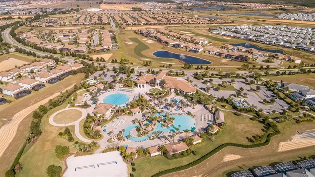 an aerial view of a residential houses with outdoor space