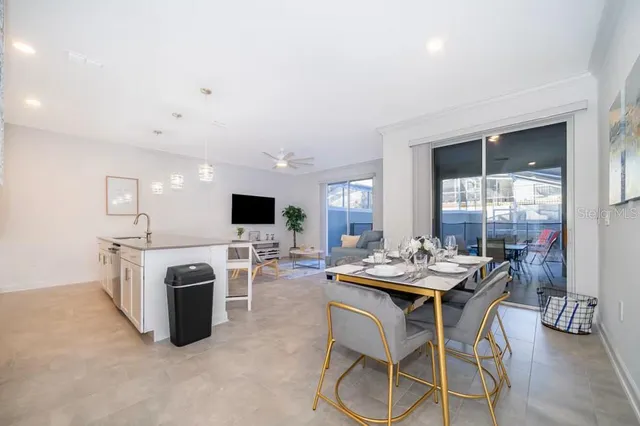 a view of a dining room with furniture and window