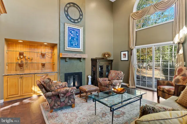 a kitchen with stainless steel appliances granite countertop a refrigerator a stove and a sink