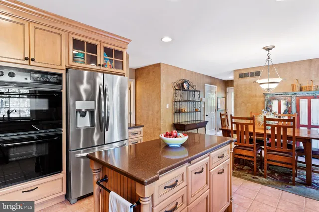 a dining room with furniture and chandelier