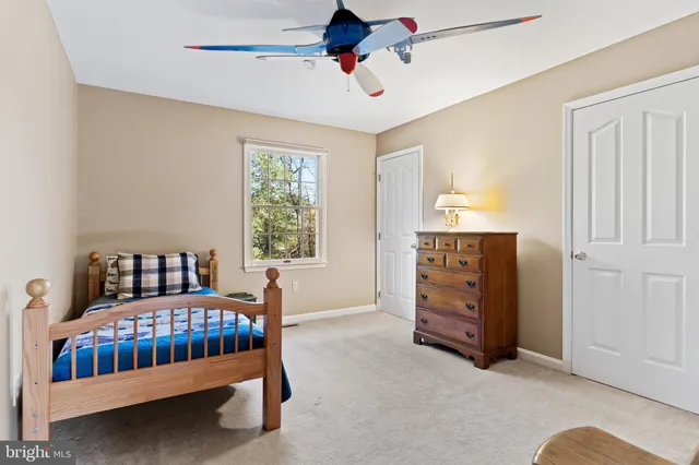 a view of a storage and utility room with washer and dryer