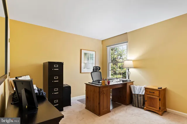 a workspace with furniture and window