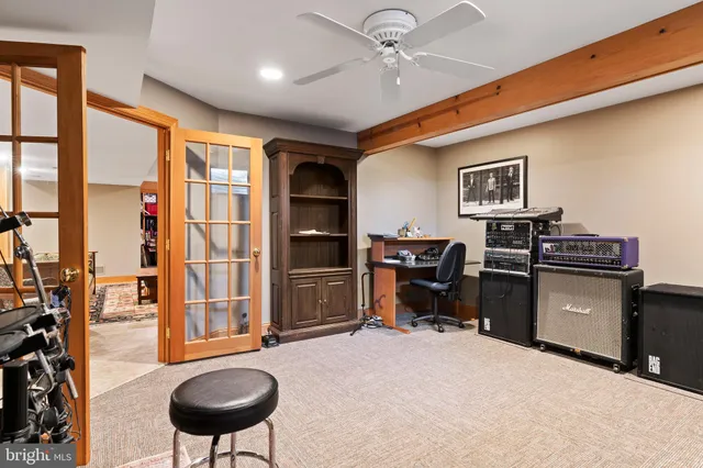 an aerial view of a house with a yard and garden