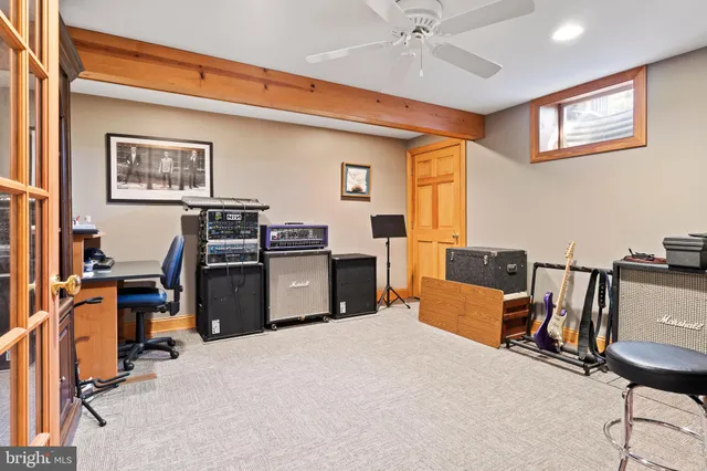 an aerial view of residential houses with outdoor space and trees
