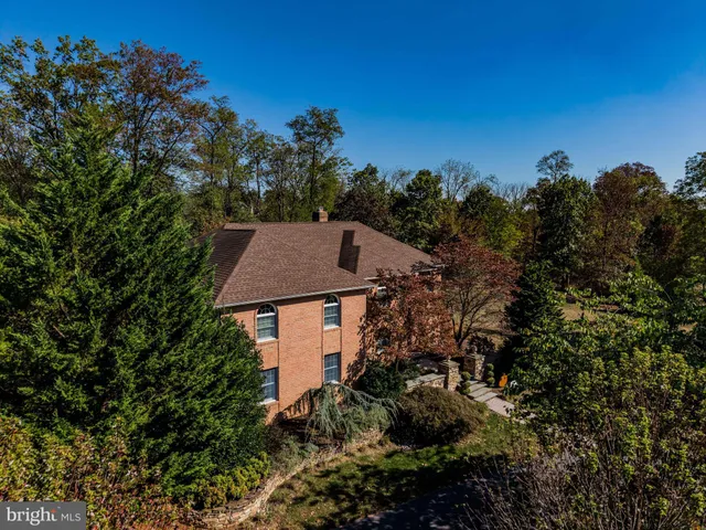 a living room with furniture a rug and a large window