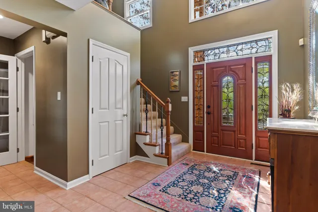a living room with furniture a rug and a fireplace