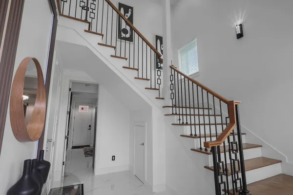 a kitchen with granite countertop a sink a stove and cabinets
