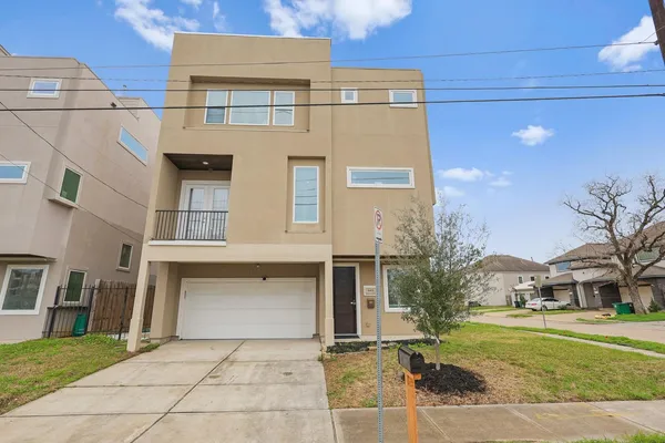 a view of a building with a backyard
