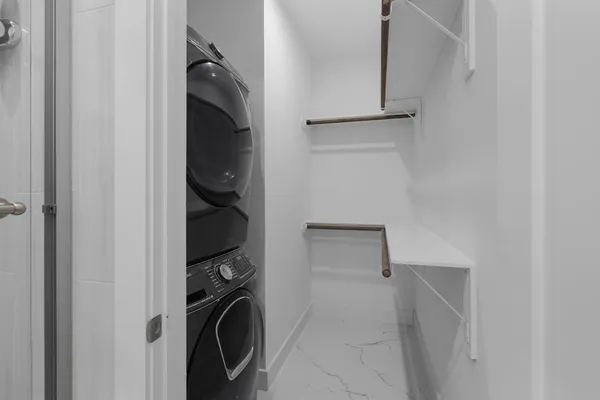 a bedroom with a bed and a television