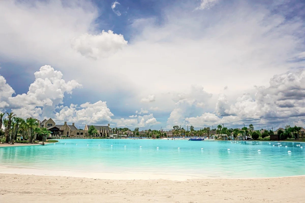 12400 Greens Road, Unit 1102 Atascocita, TX 77346 - Photo 19 of 23 a view of a lake with a city in the background