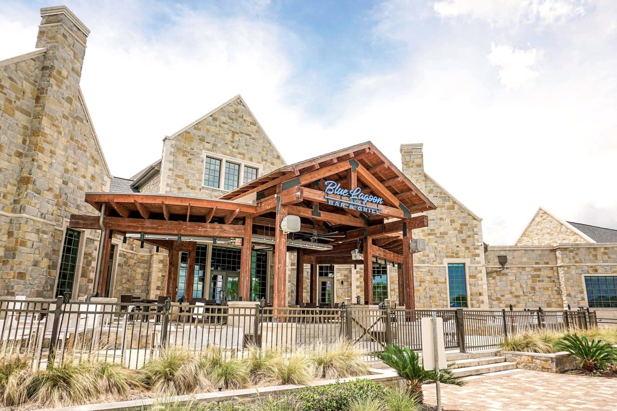 12400 Greens Road, Unit 1102 Atascocita, TX 77346 - Photo 20 of 23 front view of a house with a porch