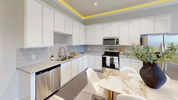 a kitchen with a sink stove and refrigerator