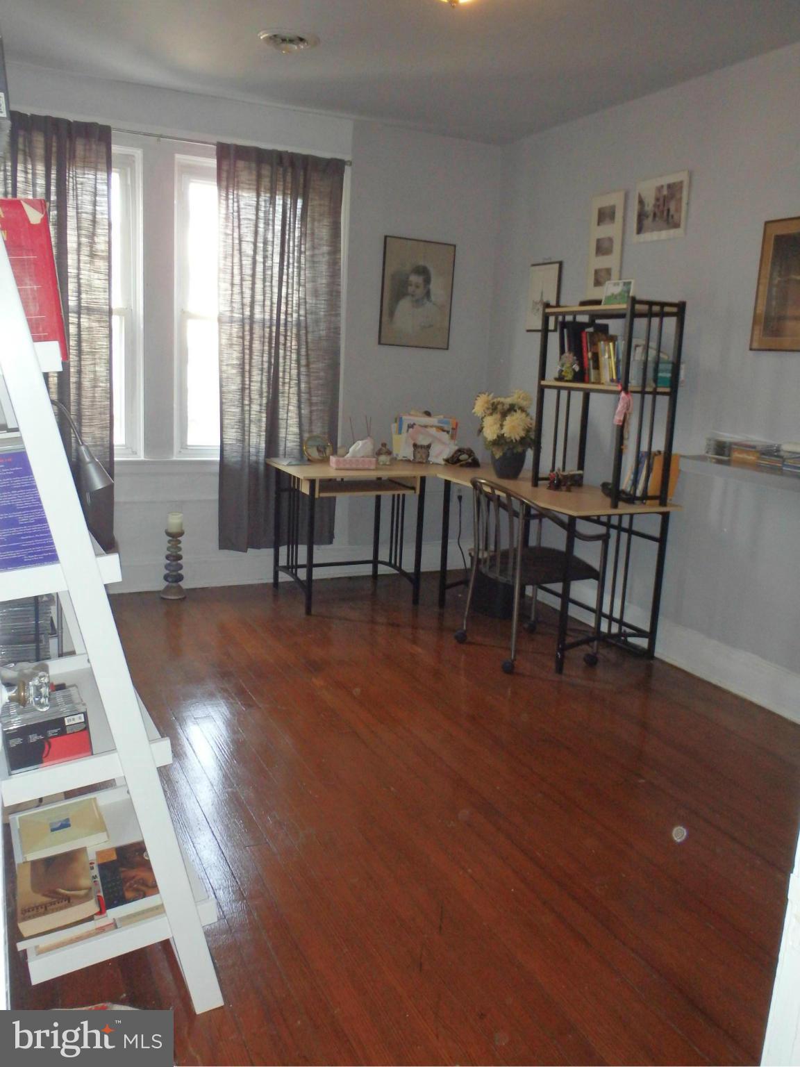 3630 Yolando Road Baltimore, MD 21218 - Photo 13 of 20 a view of a livingroom with furniture window and wooden floor