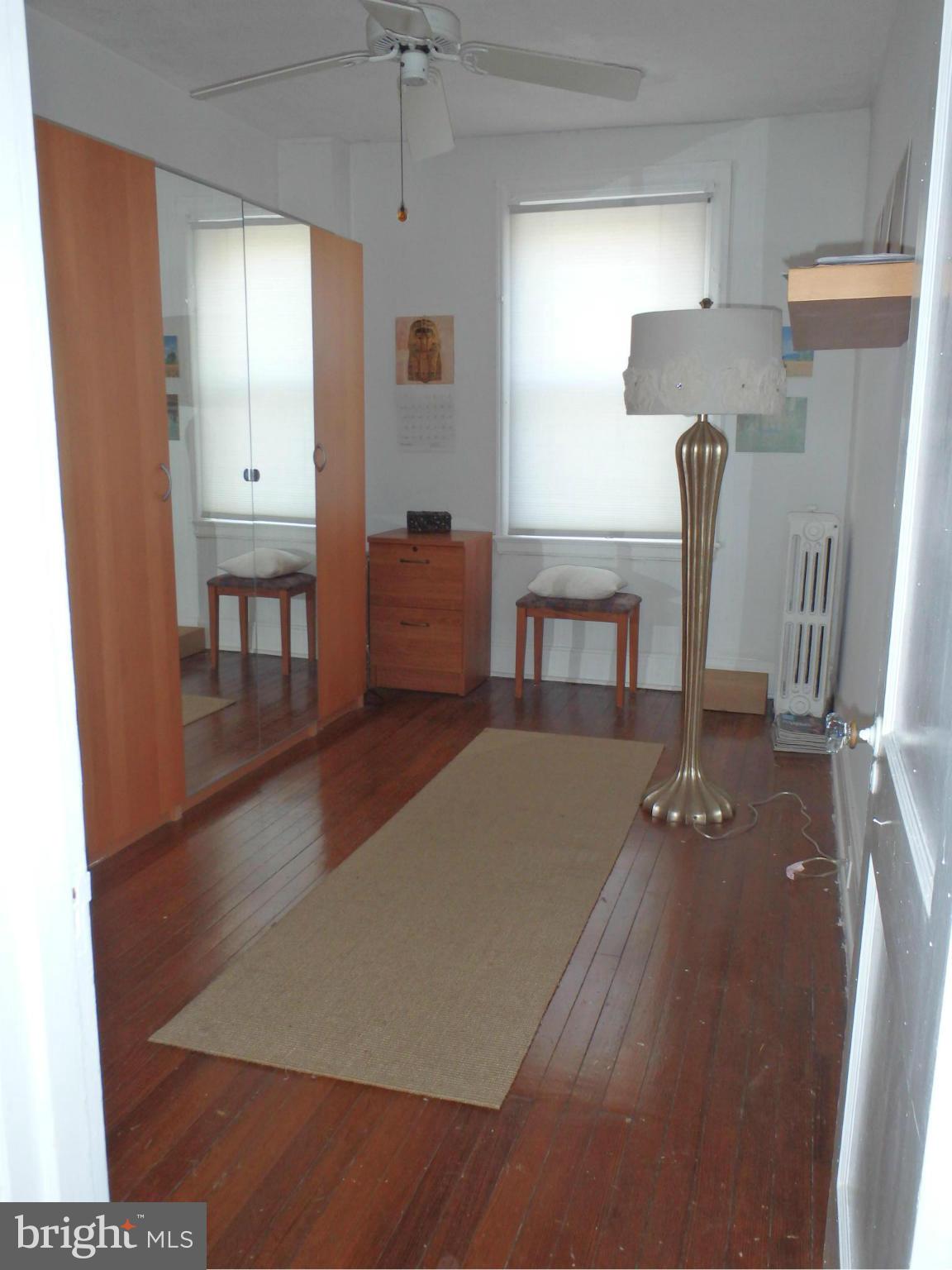 3630 Yolando Road Baltimore, MD 21218 - Photo 14 of 20 a living room with furniture a window and wooden floor