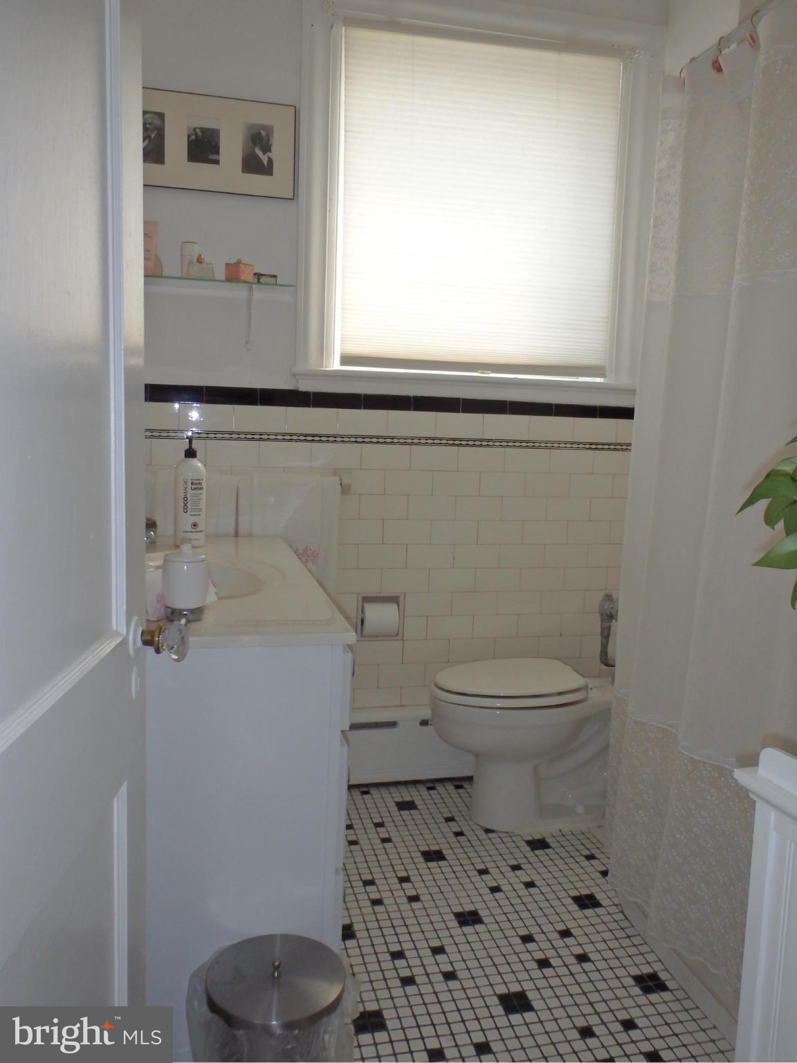 3630 Yolando Road Baltimore, MD 21218 - Photo 15 of 20 a bathroom with a toilet a sink and a window