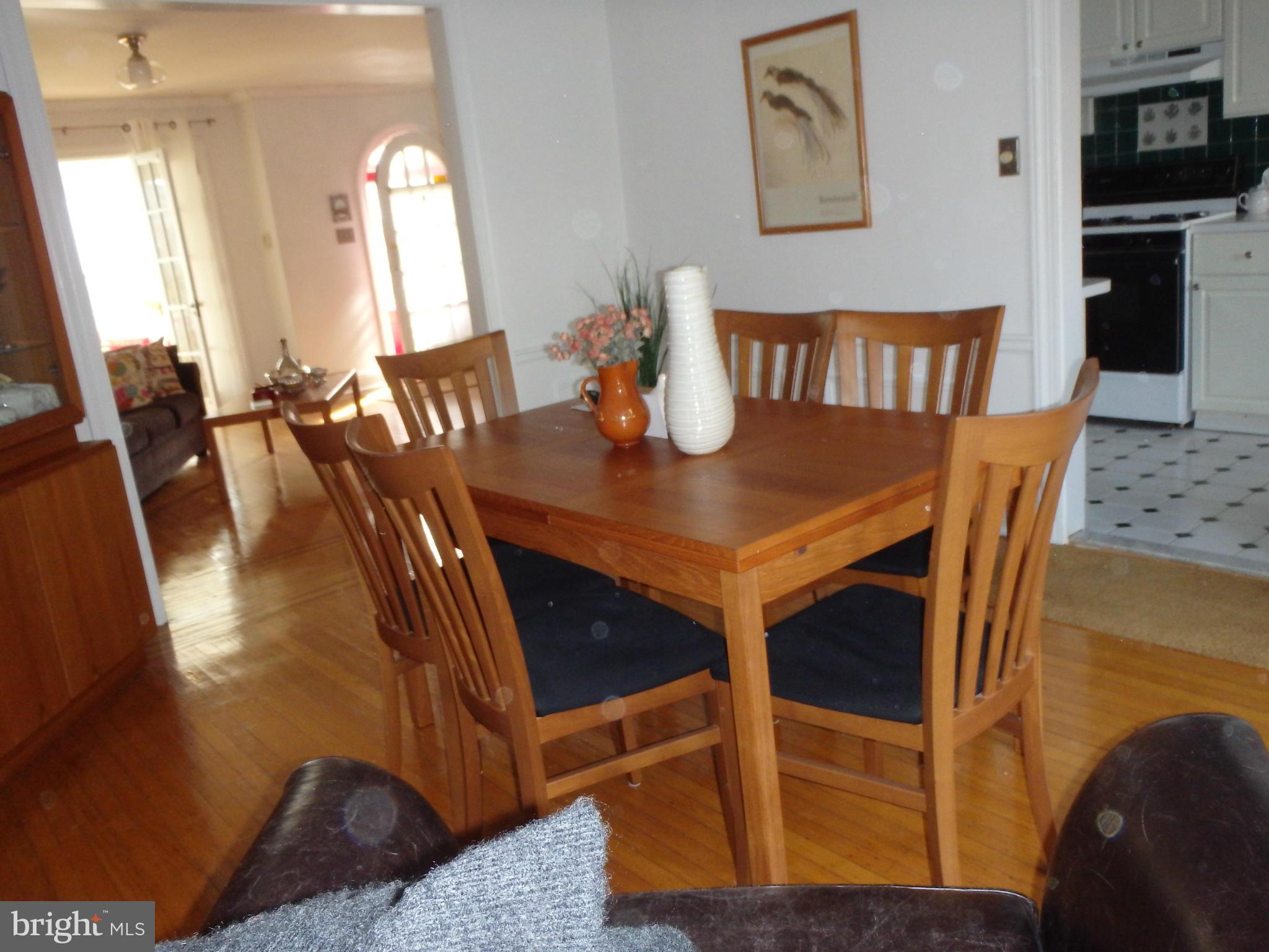 3630 Yolando Road Baltimore, MD 21218 - Photo 7 of 20 a view of a dining room with furniture and wooden floor