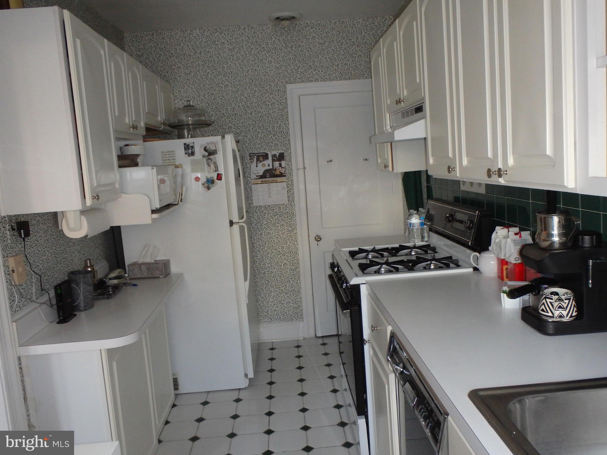 3630 Yolando Road Baltimore, MD 21218 - Photo 9 of 20 a kitchen with a refrigerator and a stove