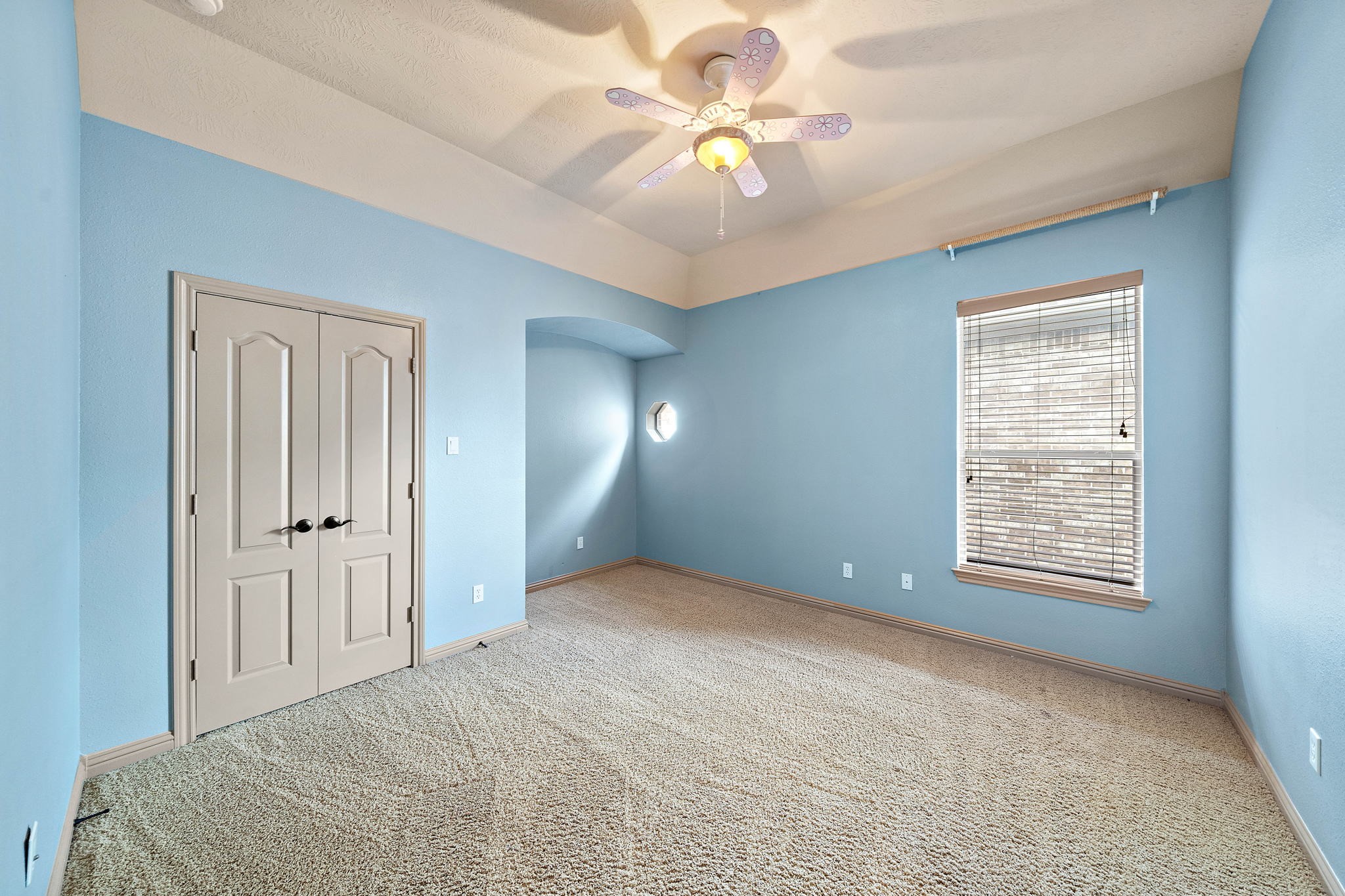 10015 Cinco Ridge Drive Katy, TX 77494 - Photo 16 of 17 a view of an empty room with a window