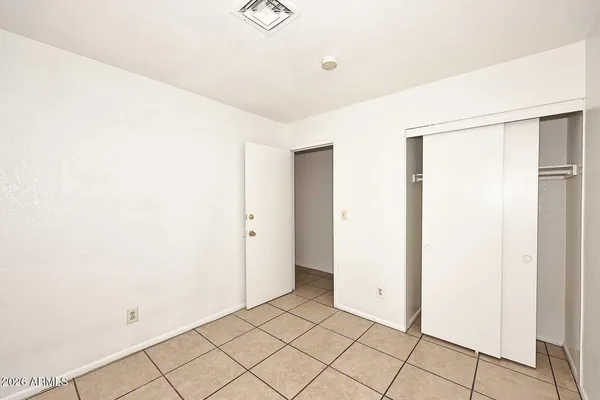 a bathroom with a bathtub shower sink vanity and toilet
