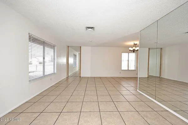 a view of an empty room and window in a room