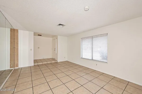a view of an empty room and window