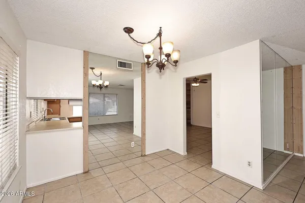 a kitchen with a stove top oven sink and refrigerator